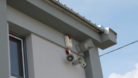 Alarm siren and searchlight